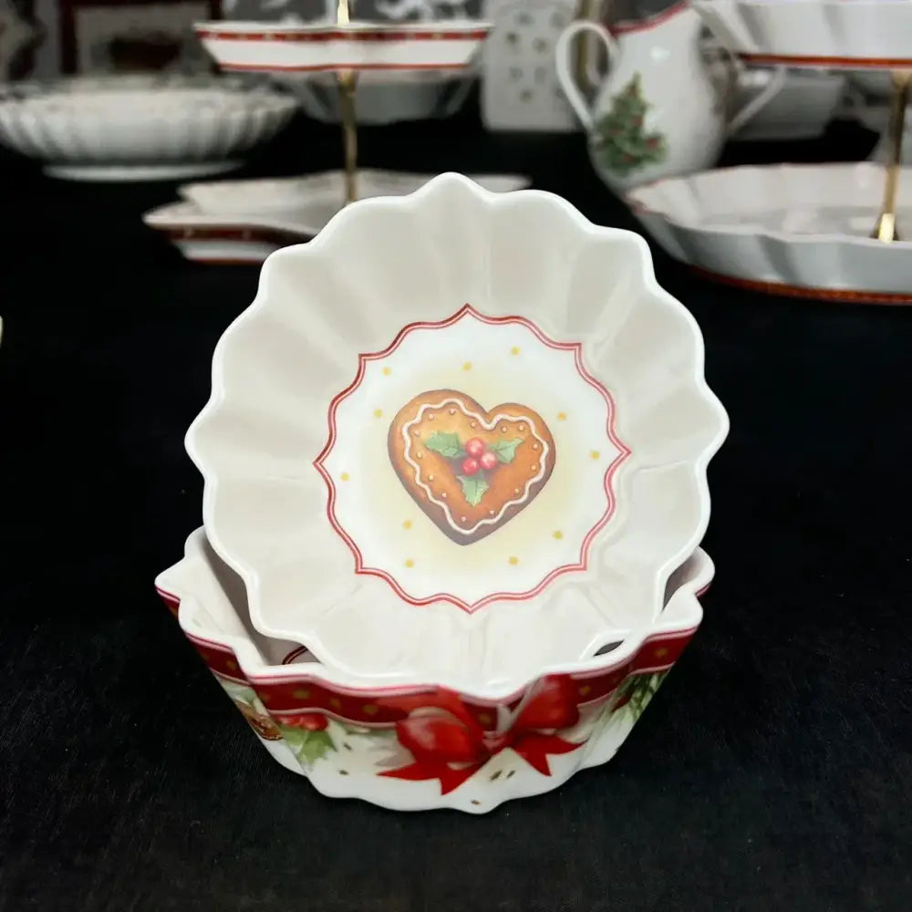White ceramic dessert bowl with scalloped edges featuring heart-shaped gingerbread design from decorbites christmas tableware