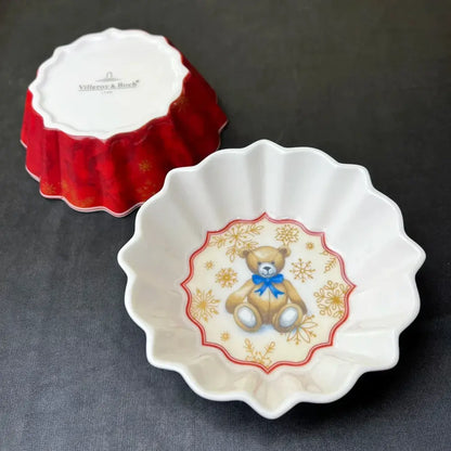 White ceramic dish with scalloped edges featuring a teddy bear and gold snowflakes from decorbites christmas tableware