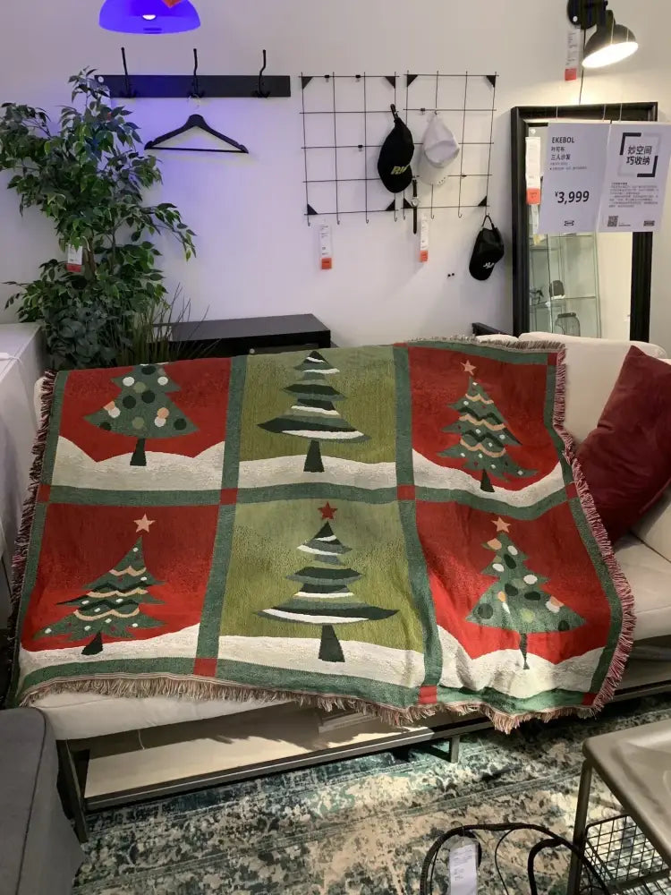 Decorbites christmas throw blanket with green and red tree pattern on squares and fringed edges for festive decor
