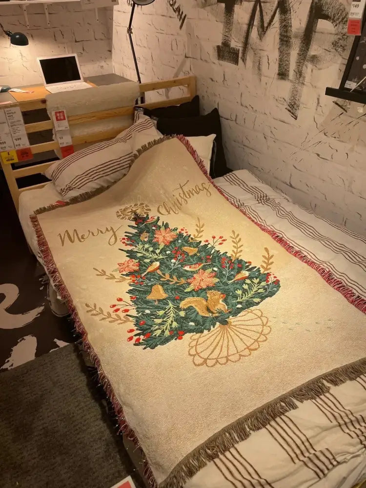 Beige DecorBites Christmas throw blanket with green and gold embroidered tree and fringed edges for festive decor