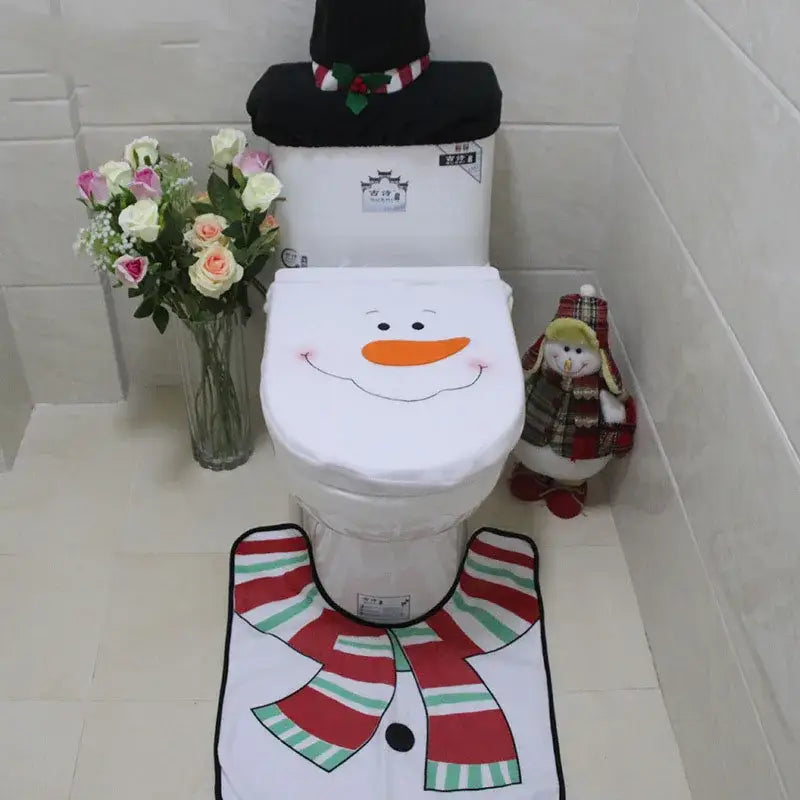 White snowman-themed toilet seat cover with black eyes and orange carrot nose in decorbites christmas toilet decoration set