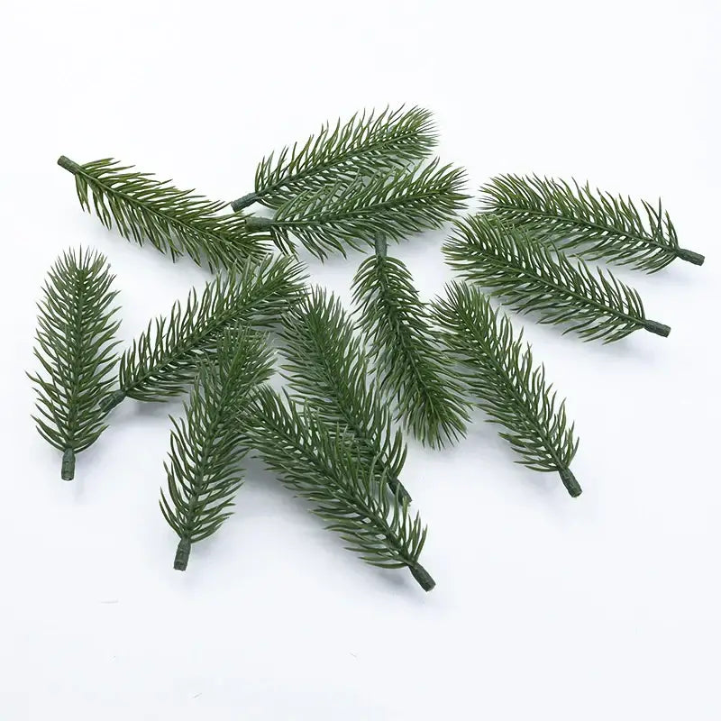 Green artificial pine branches with detailed needle-like foliage and sturdy stems for christmas tree artificial plants decor