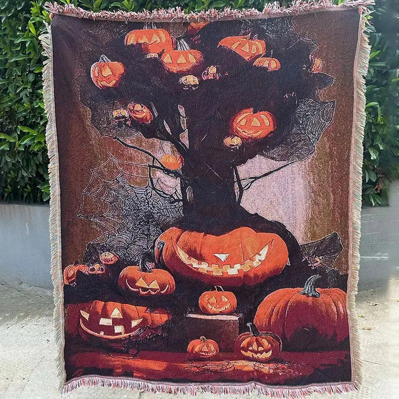 Decorbites christmas tree blanket throw featuring a spooky woven tree with glowing pumpkins and fringed edges for festive decor
