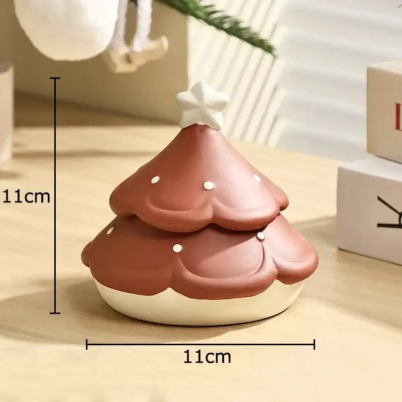 A terracotta decorbites christmas tree ceramic ashtray with white star topper and silver dots, 11cm height and width