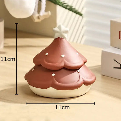 A terracotta décorBites christmas tree ceramic ashtray with white star topper and dots measuring 11cm square