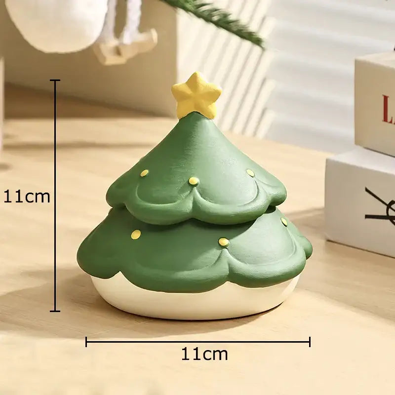 A green decorbites christmas tree ceramic ashtray with yellow star topper and gold dots measuring 11cm