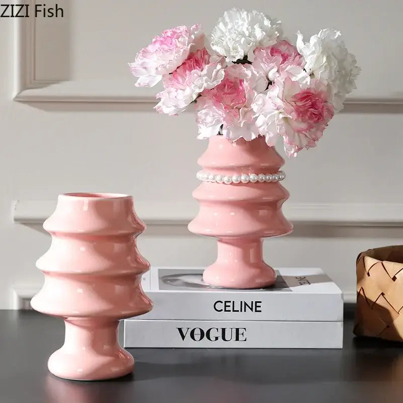 A pink ceramic vase with tiered sculptural design and pearl band from decorbites christmas tree ceramic collection