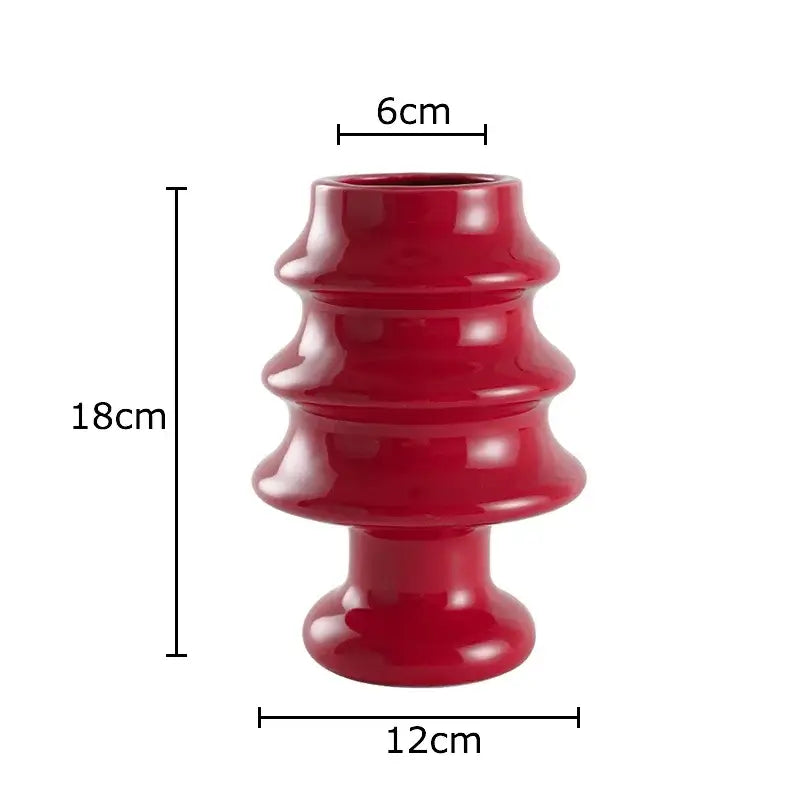 Glossy red ceramic vase with tiered fluted design and rounded base from decorbites christmas tree ceramic collection