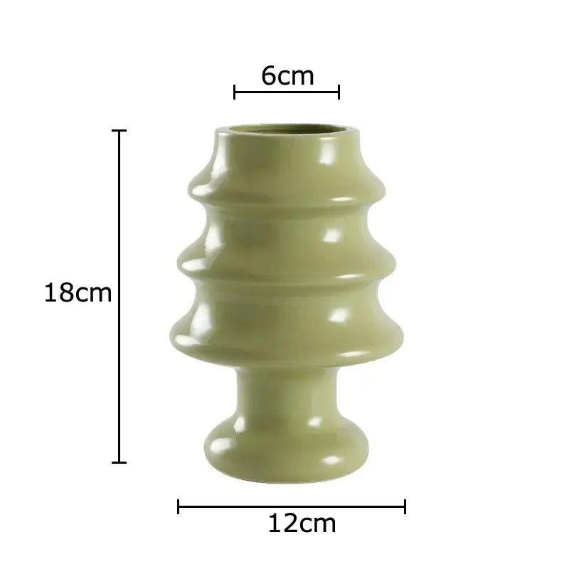 A sleek olive-green ceramic vase with tiered sculptural design and glossy finish decorbites christmas tree ceramic vase