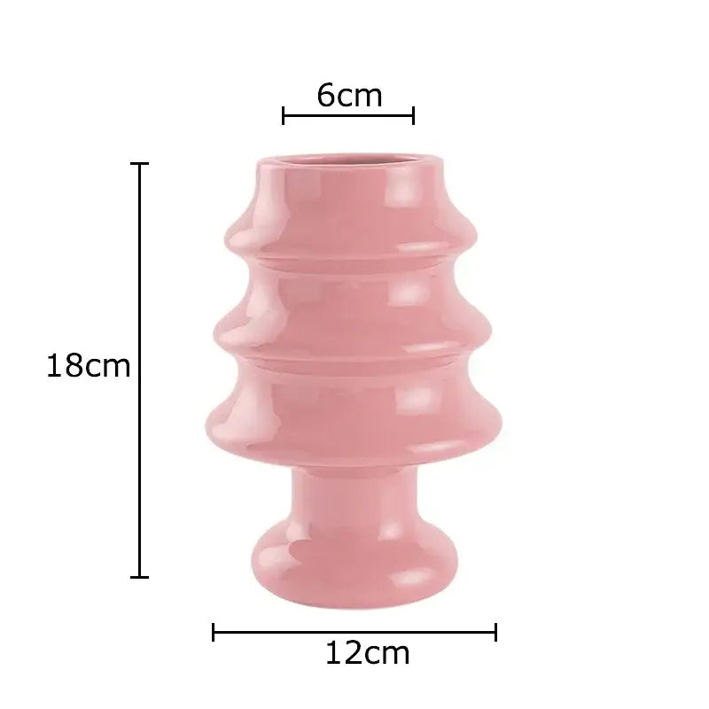 A glossy pink ceramic vase with a tiered stacked design from DecorBites Christmas Tree ceramic collection for Xmas decor