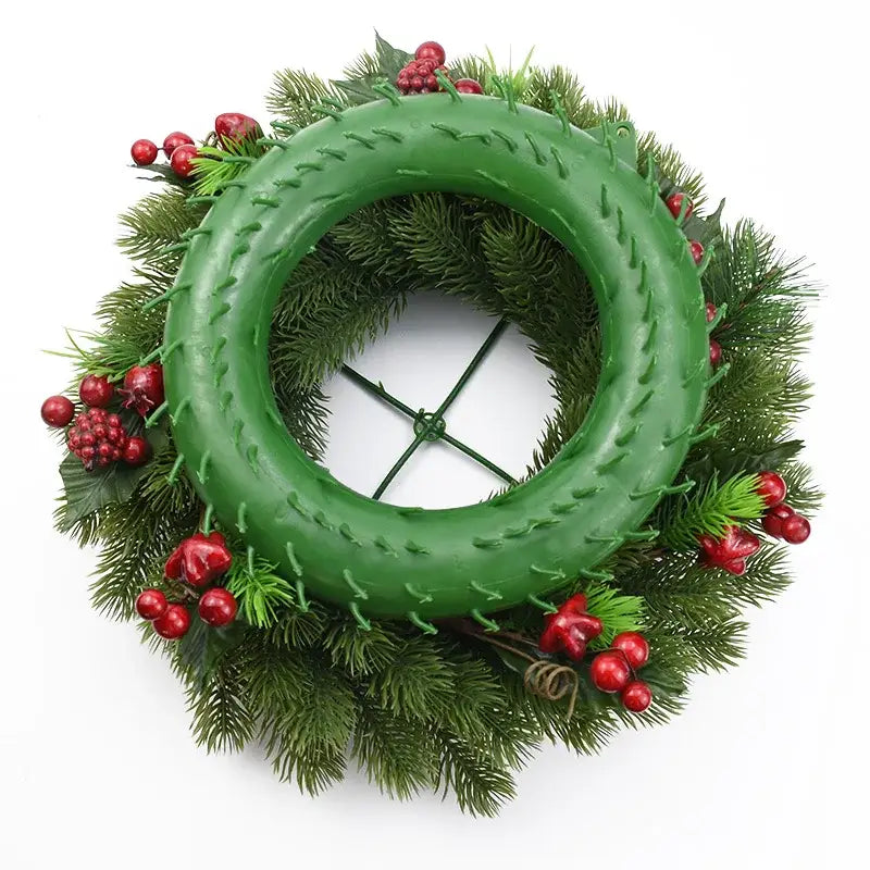 Green plastic wreath form with artificial pine needles and red berries for decorbites christmas tree decor