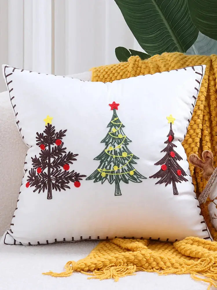 White pillow with embroidered christmas tree designs in black green and red thread decorbites christmas tree cushion covers