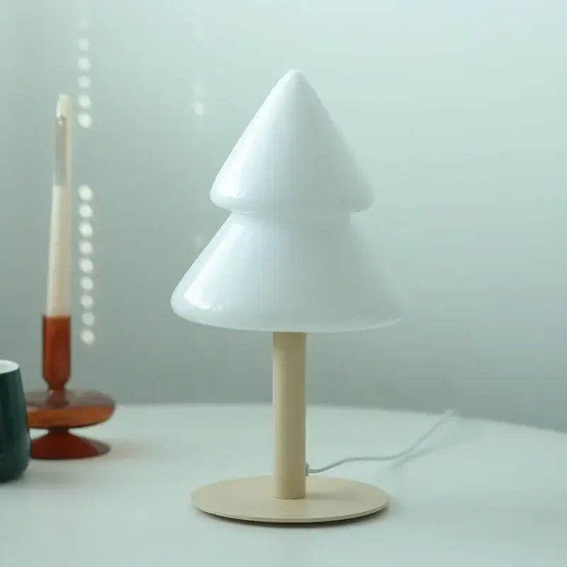 White frosted glass christmas tree table lamp with light wood base by DecorBites for living room decor