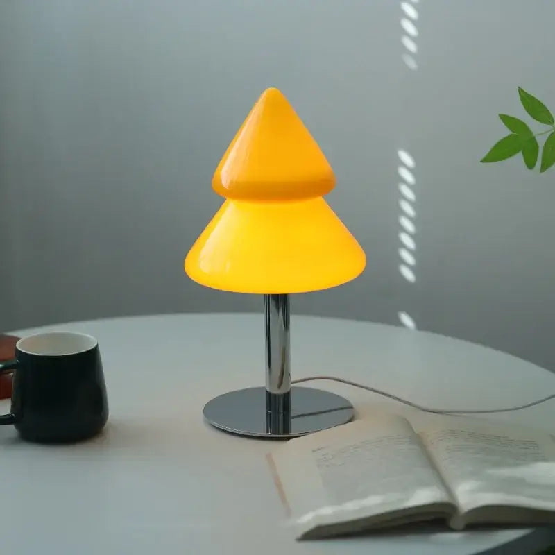DecorBites Christmas tree glass table lamp features a vibrant yellow two-tiered acrylic design with chrome base