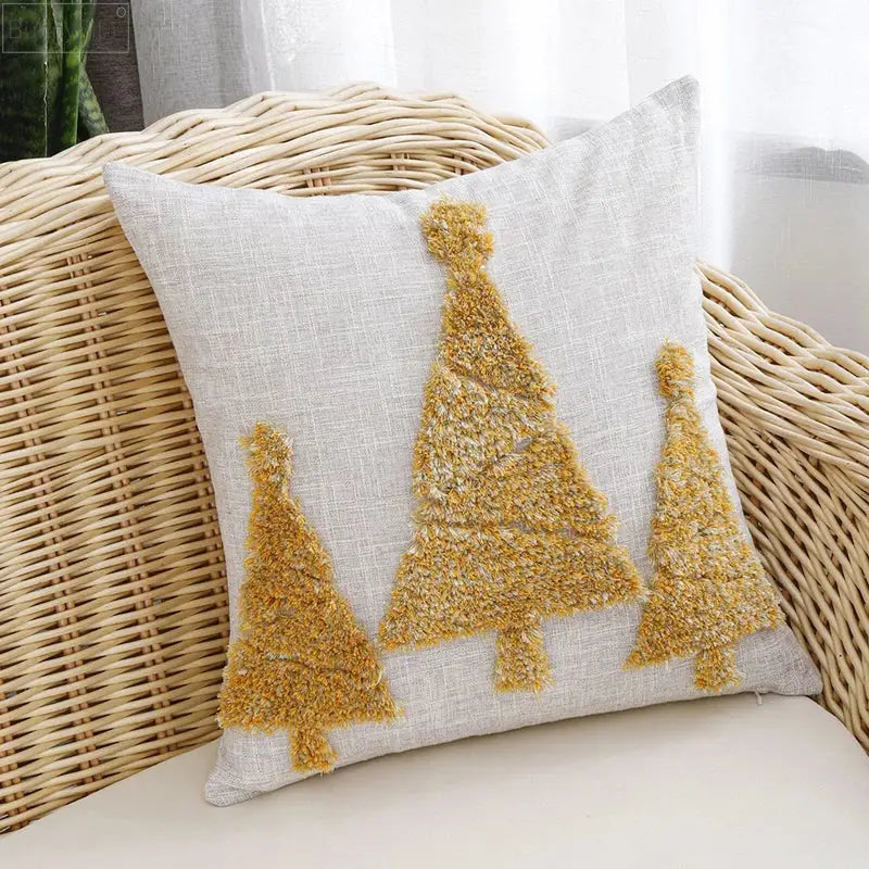 Light gray linen pillow cover with three textured gold christmas tree appliqués by DecorBites Christmas Tree gold design