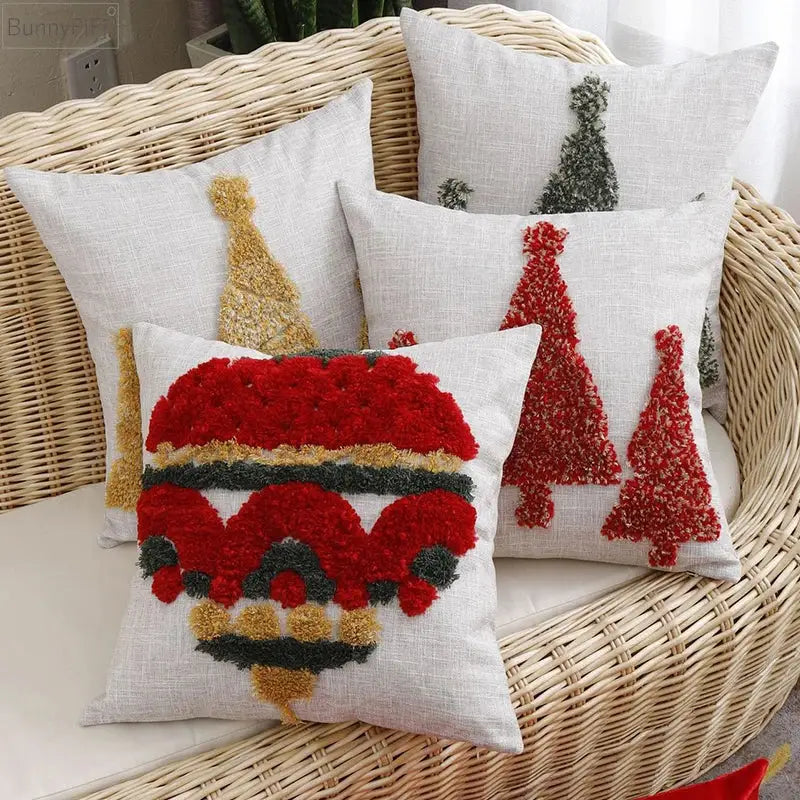 White linen pillow cover with festive red gold and green pom-pom appliqué from decorbites christmas tree gold collection