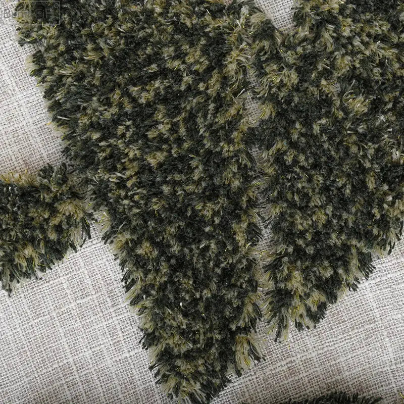 Fuzzy olive-green and black textured fabric pillow cover with plush appearance for decorbites christmas tree gold design