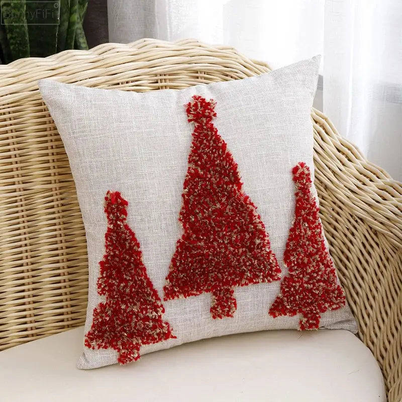 Beige linen pillow cover with three red textured christmas tree appliqués from decorbites christmas tree gold series