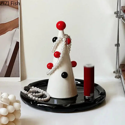 White ceramic DecorBites christmas tree jewelry stand with red and black spherical accents for earring and necklace storage