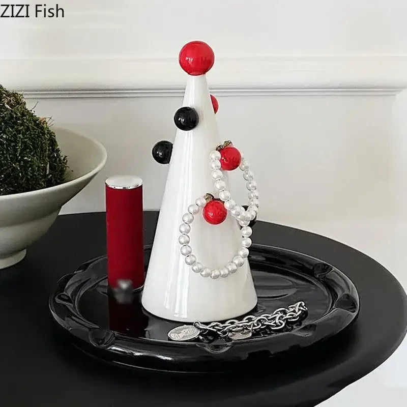 White ceramic christmas tree jewelry stand by decorbites christmas tree adorned with red and black ornaments