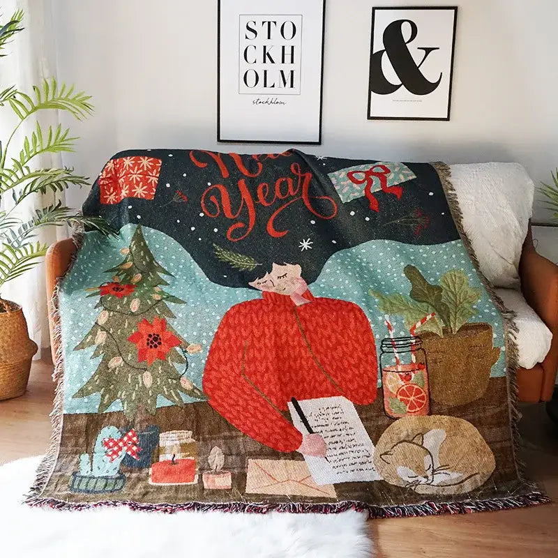 A cozy dark teal decorbites christmas tree knitted throw blanket with festive person writing letters by christmas tree and plants