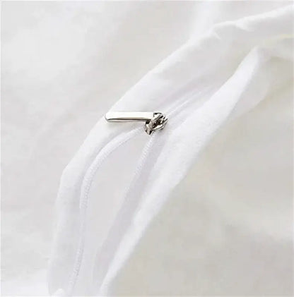 Silver zipper pull on white fabric of DecorBites™ cinnamoroll duvet cover in cute home decor bedding set