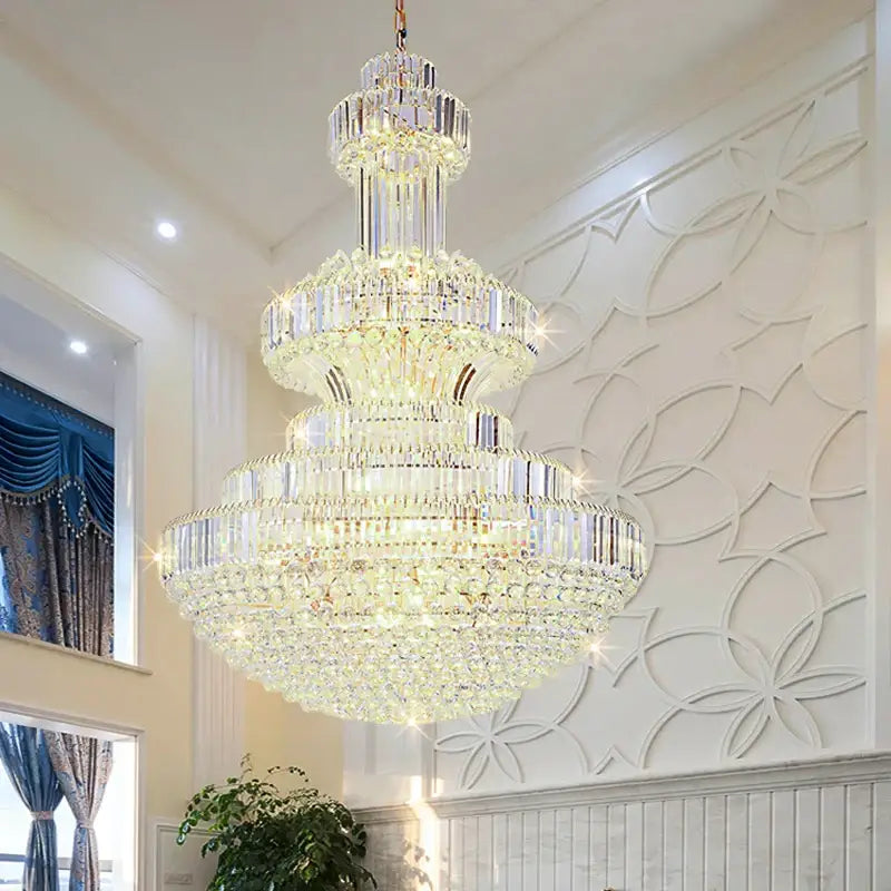 A decorbites classic crystal chandelier with cascading clear faceted crystals and warm gold lights for living rooms