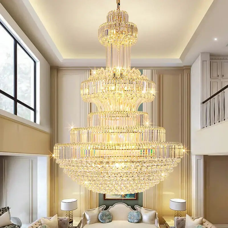 A decorbites classic crystal chandelier with clear and gold-toned glass tiers suspended in an elegant living room