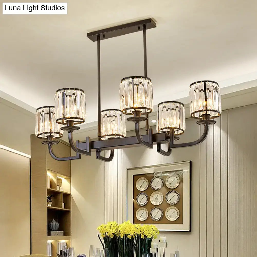 Modern bronze-finished chandelier with six cylindrical crystal shades for dining room island lighting by DecorBites™