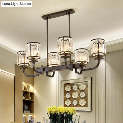 Modern bronze-finished chandelier with six cylindrical crystal shades for dining room island lighting by DecorBites™