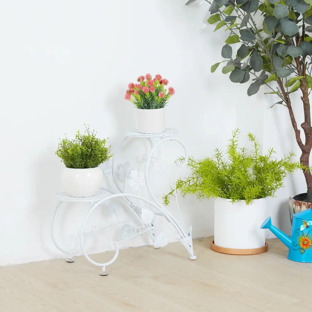 White wrought iron classic tall plant stand with curved decorative legs and three tiers for indoor and outdoor use