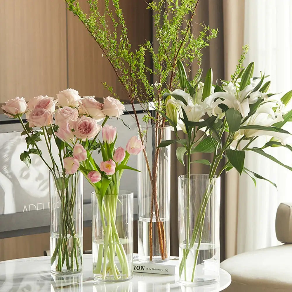 DecorBites™ large clear acrylic hurricane flower vase holding pink roses, tulips, and white lilies in a clear flower vase