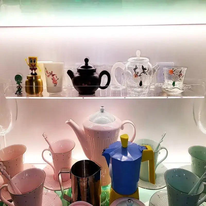Blue and yellow moka pot with geometric design on a wall mounted clear acrylic DecorBites™ shelf organizer 20-50cm