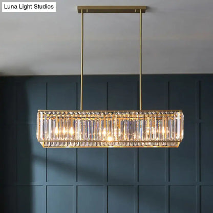 Gold-toned clear crystal island pendant light with vertical rods and minimalistic rectangular design for living room ceiling