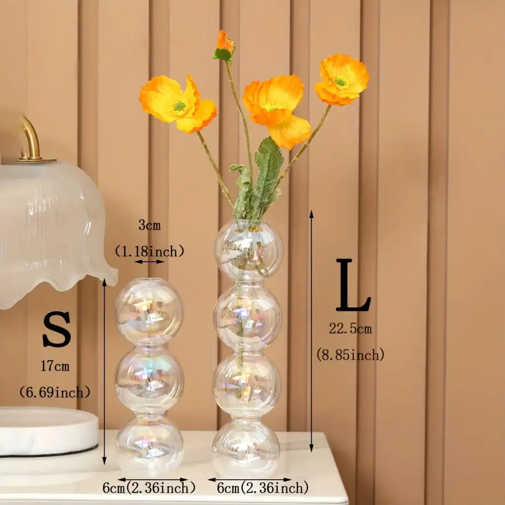 DecorBites™ clear glass bubble vase with iridescent finish holding vibrant orange poppies for home decor