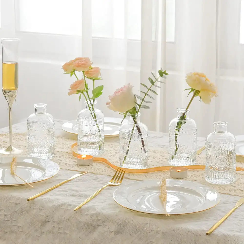 DecorBites™ clear glass bud vases set featuring embossed patterns holding delicate pink and cream roses