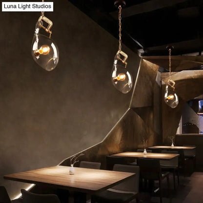 DecorBites™ clear glass fish pendant light with brass hardware and warm bulbs for modern dining spaces