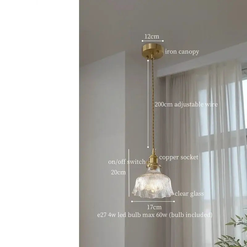 A delicate decorbites clear glass led pendant light with fluted design and brass accents for bedroom use