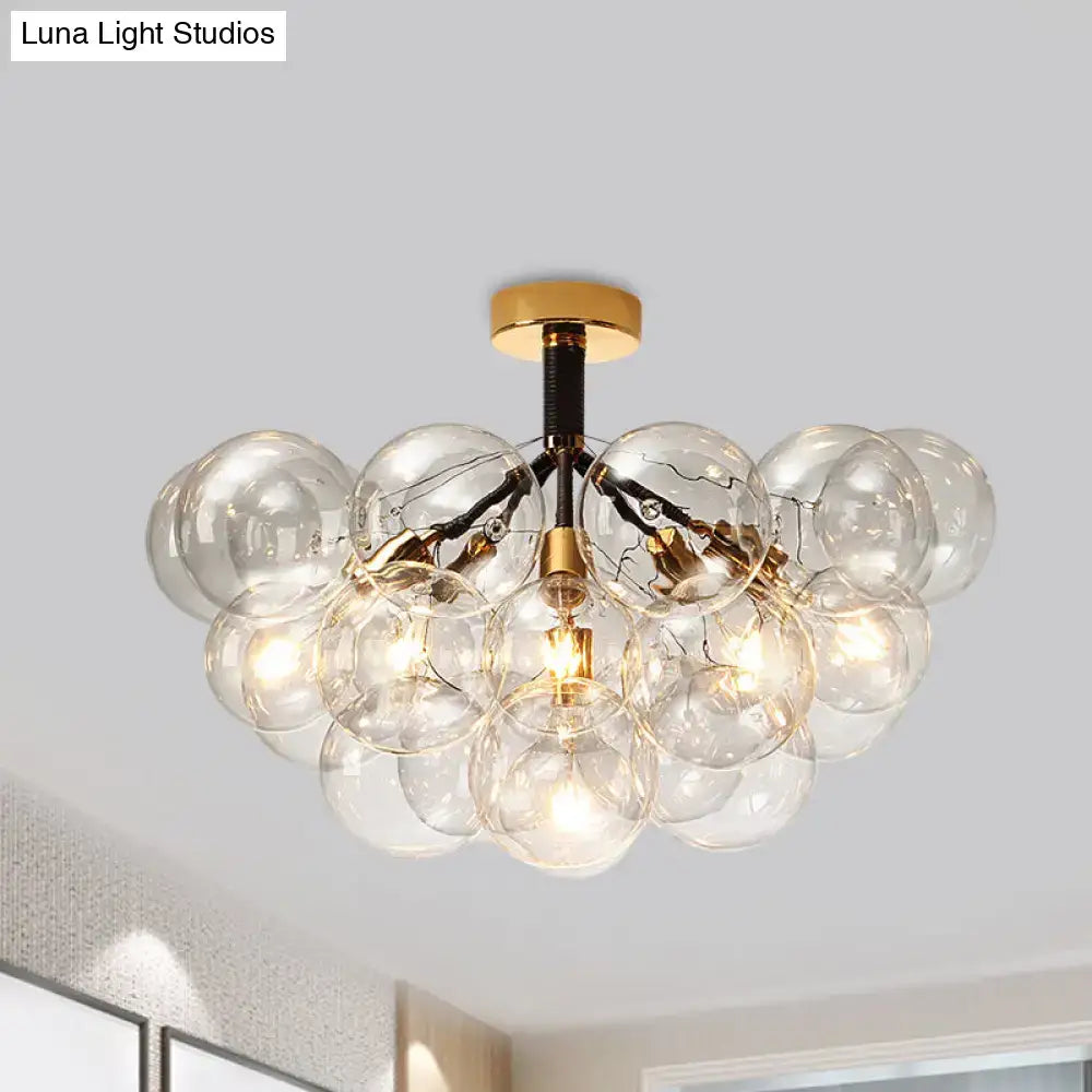 Decorbites clear glass semi flush ceiling light with brass accents and exposed filament bulbs for foyer illumination