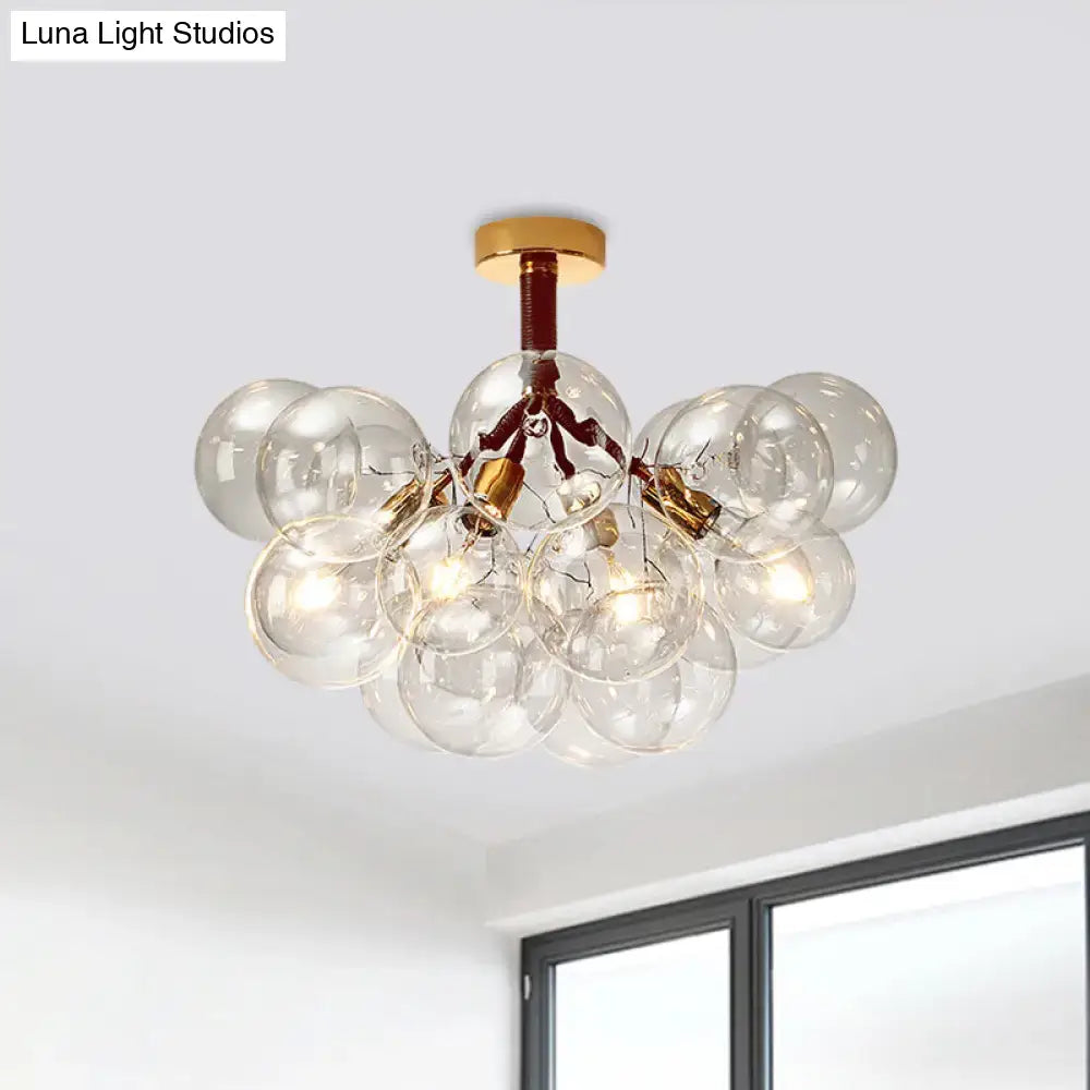 Decorbites clear glass semi flush ceiling light with brass accents and exposed filament bulbs for foyer illumination