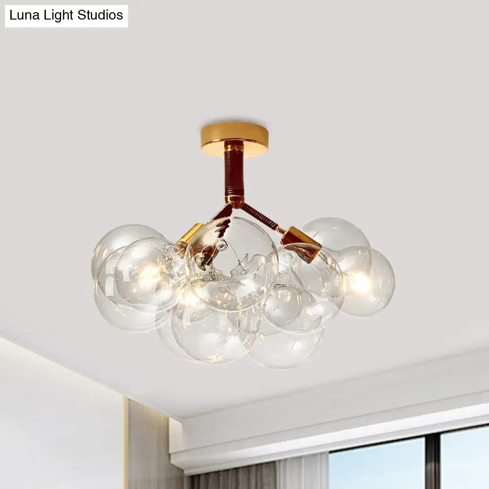 Decorbites clear glass semi flush ceiling light with brass accents and modern bubble design for foyer illumination