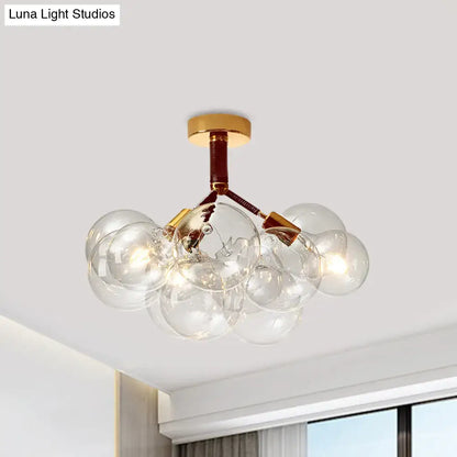 Decorbites clear glass semi flush ceiling light with brass accents and bubble design for foyer illumination