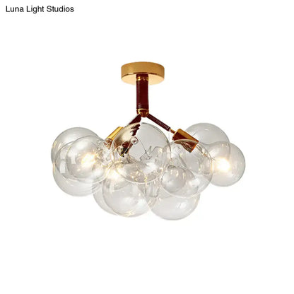 Gold-toned decorbites semi flush ceiling light with clear glass globe bulbs for foyer and corridor illumination