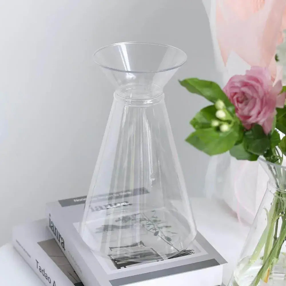 Clear nordic plastic vase with flared top and tapered body designed for hydroponic flowers by DecorBites