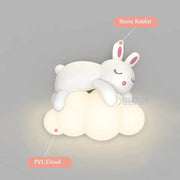 Cute white resin rabbit perched on glowing pvc cloud in decorbites cloud bunny lamp for bedroom wall light