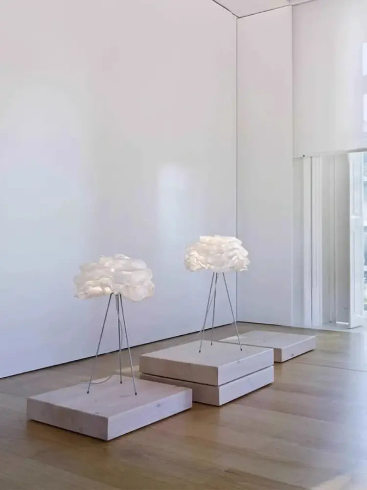 A modern decorbites cloud chandelier sculptural cream pendant light with translucent polymer shade and stainless steel base
