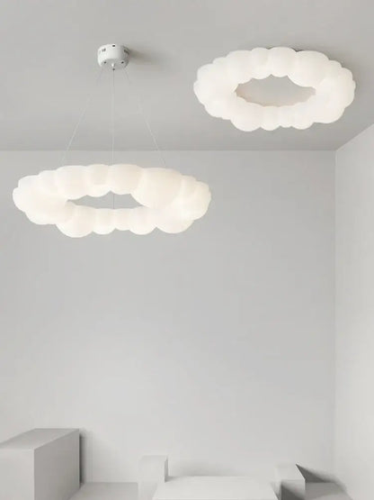 Decorbites cloud led chandelier with white frosted glass pendant lights providing soft diffused bedroom lighting