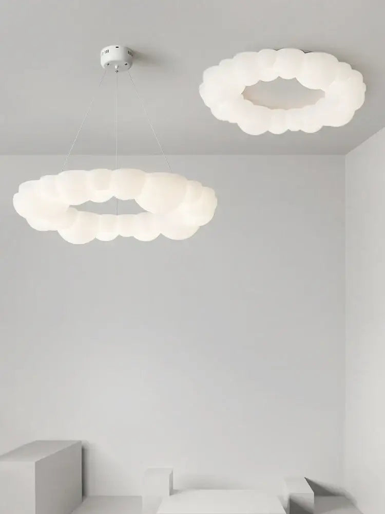 Decorbites cloud led chandelier with white frosted glass pendant lights providing soft diffused bedroom lighting