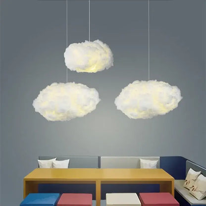 Three fluffy white decorbites cloud led pendant lights emitting a soft warm glow for bedroom illumination