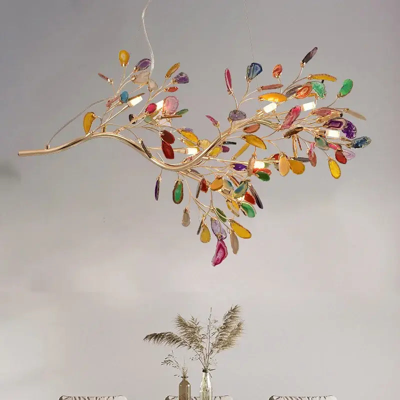 A decorbites colorful agate chandelier with gold-toned arms and multicolored agate slices for dining room and bedroom